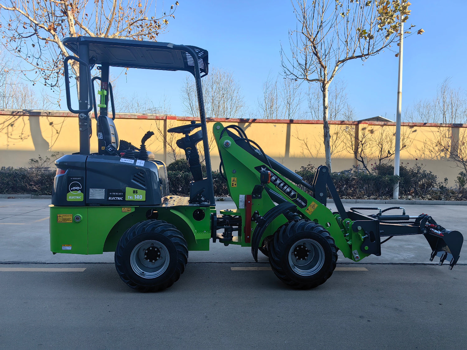 Texlift Electric Loader in operation, showcasing its compact design, powerful lifting capabilities, and user-friendly controls.