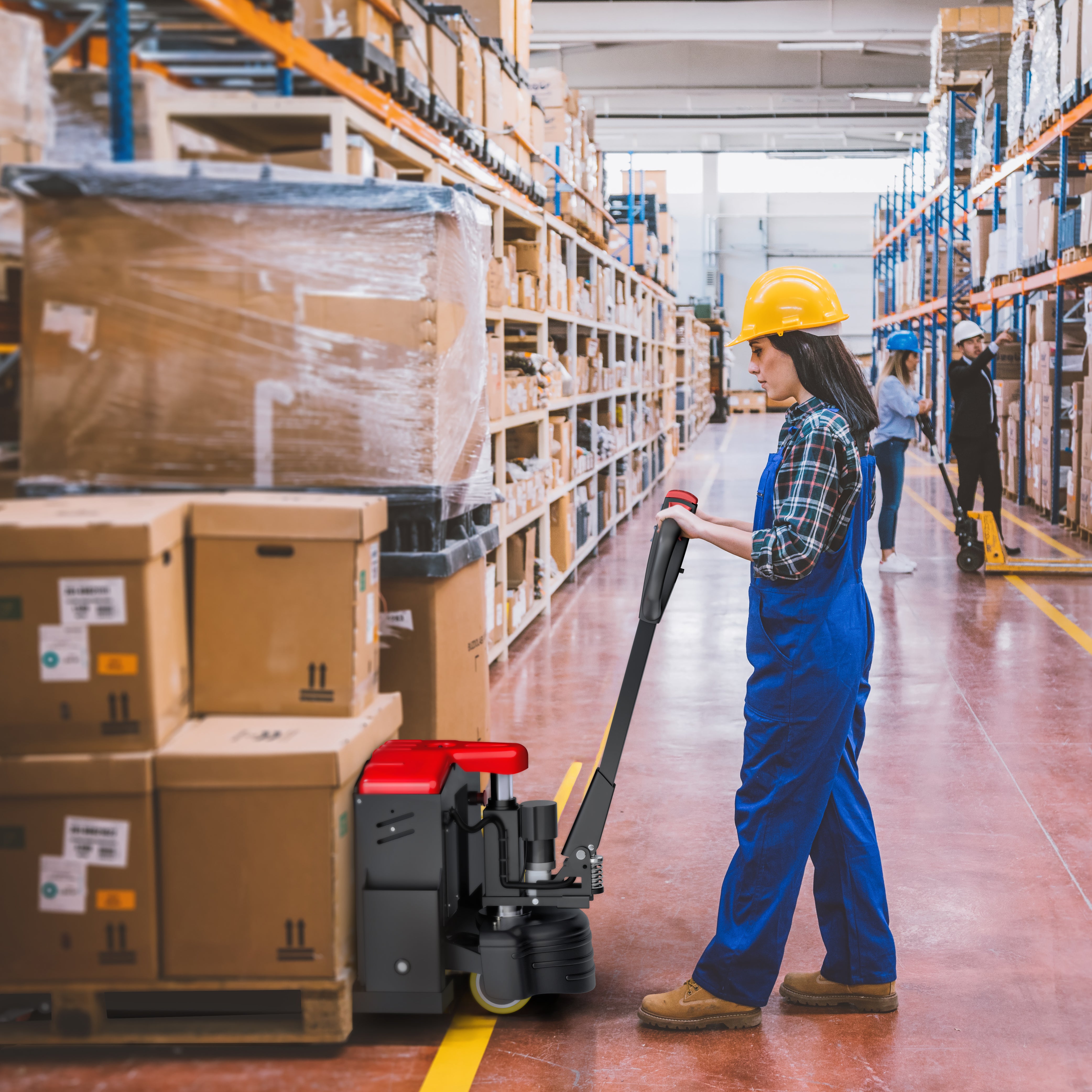 Worker in a warehouse using a pallet jack to move boxes.