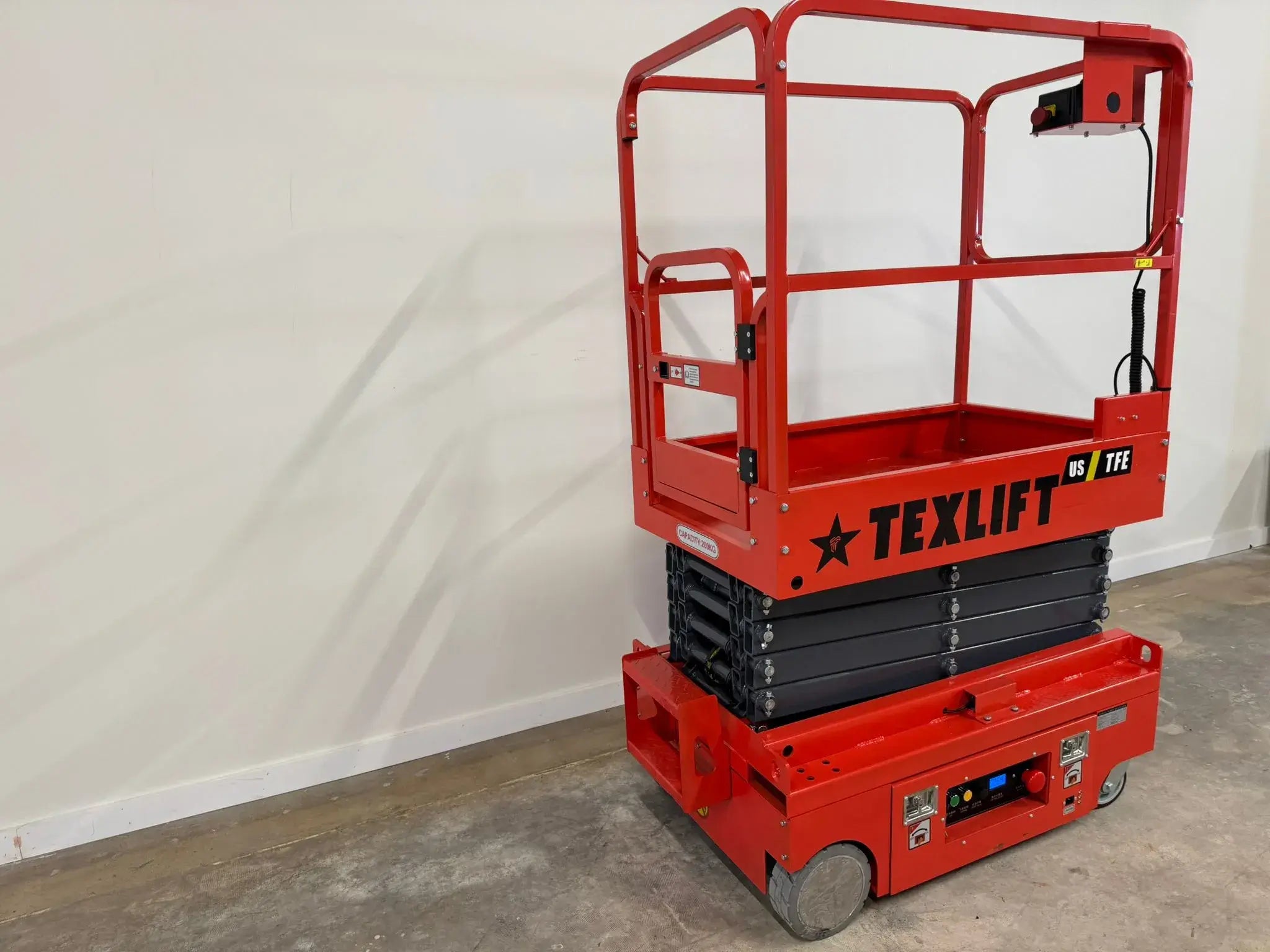 Electric scissor lift with high platform height, large load capacity, and energy-efficient operation for construction and maintenance tasks.